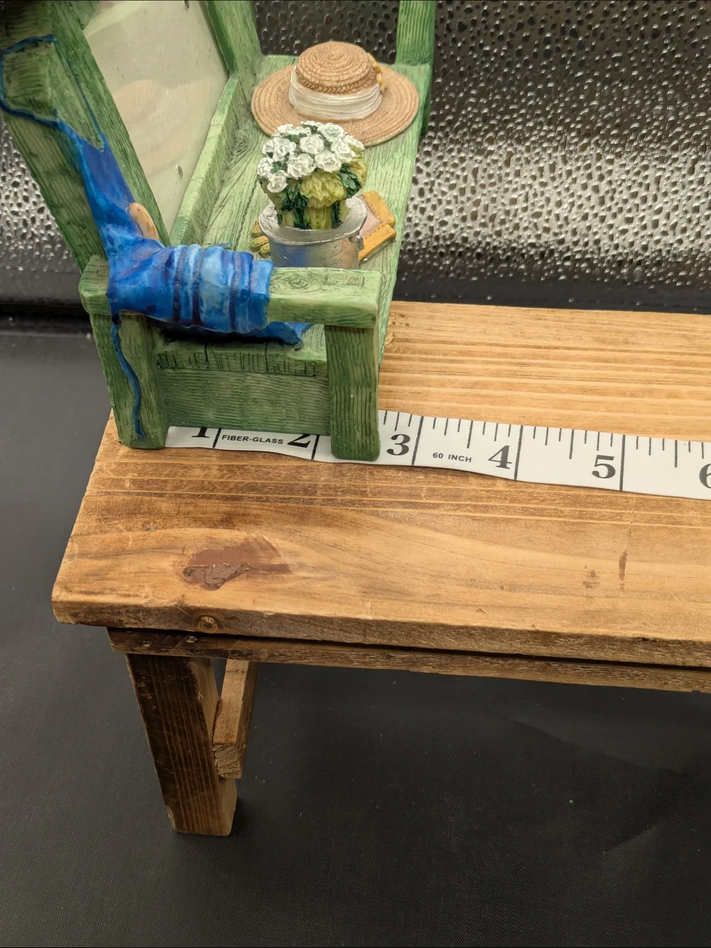 Green Wooden Bench Picture Frame with Hat and Potted Flowers